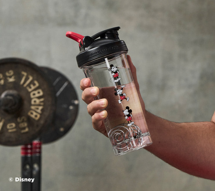 pro-series-w3 Mickey_Mouse_Protein_Shaker_Bottle_Being_Held_In_the_Gym.jpg